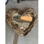 A HEART SHAPED DRIFTWOOD FRAMED MIRROR 42CM X 36CM