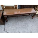 A LONG MAHOGANY HALL TABLE ON CABRIOLE SUPPORTS