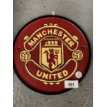 A ROUND CAST 'MANCHESTER UNITED' SIGN 24CM