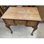 A GEORGE III LIGHT OAK AND CROSSBANDED LOWBOY WITH THREE DRAWERS, ON CABRIOLE LEGS, 29" WIDE