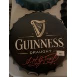 A VINTAGE GARAGE RETRO 'GUINNESS' HANGING WALL BEER BOTTLE CAP DISPLAY SIGN 35 CM