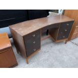 A RETRO DRESSING TABLE WITH SEVEN DRAWERS