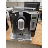 AN EXCLUSIVE LINE COFFEE MACHINE BELIEVED IN WORKING ORDER BUT NO WARRANTY