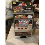 A BOXED LAS VEGAS SLOT MACHINE MONEY BOX