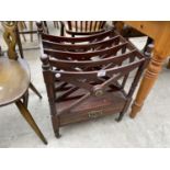 A CANTERBURY STYLE MAHOGANY MAGAZINE RACK ON BRASS CASTERS WITH SINGLE DRAWER