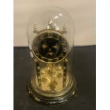 A DECORATIVE MANTEL CLOCK WITH GLASS DOME H: 30CM