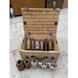 A WICKER HAMPER TO ALSO INCLUDE VINTAGE STONE WARE BOTTLES