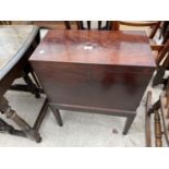 A GEORGE III MAHOGANY SIX DIVISION CELLARETTE ON STAND WITH TAPERED LEGS AND BRASS CARRYING HANDLES,