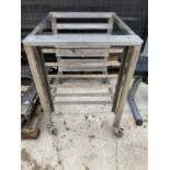 AN INDUSTRIAL KITCHEN TRAY STAND