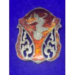 A SIAM SILVER AND ENAMEL BROOCH