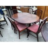 AN EXTENDING MAHOGANY DINING TABLE AND SIX CHAIRS