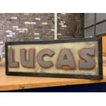 AN ILLUMINATED 'LUCAS' LIGHTBOX SIGN