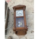 A 1920s GERMAN OAK CHIMING WALL CLOCK COMPLETE WITH KEYS