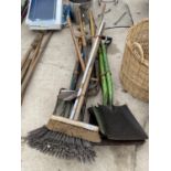 A LARGE QUANTITY OF GARDEN TOOLS TO INCLUDE FOUR SHOVELS, THREE FORKS, EDGING SHEARS AND BRUSHES ETC