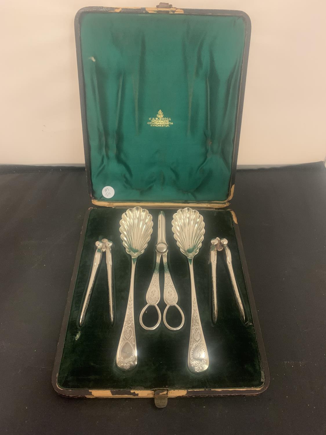 A VINTAGE BOXED SET OF SILVER PLATED FRUIT TOOLS TO INCLUDE A PAIR OF GRAPES SCISSORS AND A PAIR