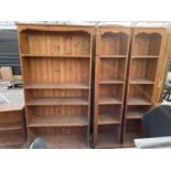 A PINE FIVE TIER BOOKCASE AND TWO FURTHER NARROW PINE FIVE TIER BOOKCASES