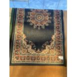 A BLACK PATTERNED RUG (59"X39.5")