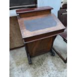 AN EDWARDIAN WALNUT AND INLAID DAVENPORT