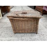 A WICKER FISHING BASKET