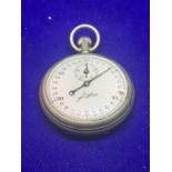 A VINTAGE JUNGHANS STOP WATCH IN WORKING ORDER (DAMAGE TO ENAMEL FACE SEE PHOTOGRAPH)