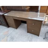 A MODERN DRESSING TABLE WITH FOUR DRAWERS
