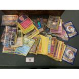 A LARGE ASSORTMENT OF COLLECTABLE POKEMON AND KONAMI CARDS
