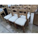 A SET OF SIX MODERN BEECH LADDERBACK DINING CHAIRS