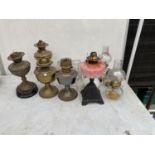 AN ASSORTMENT OF OIL LAMPS AND OIL LAMP PARTS