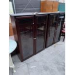 TWO STAG MINSTREL MAHOGANY CABINETS, EACH WITH TWO GLAZED DOORS