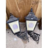 A PAIR OF DECORATIVE CAST IRON OUTDOOR LIGHTS