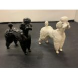 TWO BESWICK POODLE DOGS ONE BLACK ONE WHITE