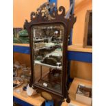 A MAHOGANY FRAMED MIRROR WITH INLAID AND CARVED DETAIL