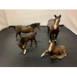 TWO BROWN BESWICK HORSES AND TWO FOALS
