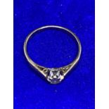 A 9 CARAT GOLD RING WITH A DIAMOND SOLITAIRE SIZE O/P GROSS WEIGHT APPROXIMATELY 1.9 GRAMS