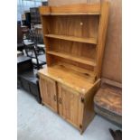 A MODERN PINE DRESSER WITH PLATE RACK, 36" WIDE