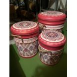 A SET OF THREE GRADUATED PINK PAISLEY LEATHER EFFECT LIDDED STORAGE STOOLS