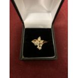 A DECORATIVE ABSTRACT DESIGN 18 CARAT GOLD DIAMOND CLUSTER RING 3.47G APPROXIMATELY 60 PTS SIZE: O