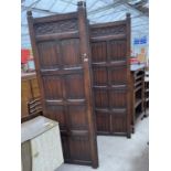 A JACOBEAN STYLE OAK THREE DIVISION SCREEN, ONE SIDE WITH CARVED PANELS, 81" HIGH, EACH PANEL