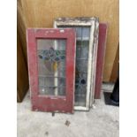 AN ASSORTMENT OF VINTAGE WOODEN FRAMED STAINED GLASS WINDOWS