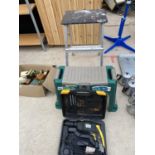 A MCKELLER POWER DRILL, A TWO RUNG STEP/SEAT AND A GARDENING AID