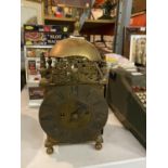 A BRASS LANTERN CLOCK