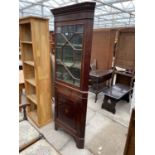 AN EDWARDIAN MAHOGANY AND INLAID CORNER CUPBOARD WITH ASTRAGAL GLAZED TOP SECTION AND DENTIL