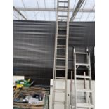 A SET OF LARGE EXTENDING LADDERS