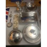 A LARGE ASSORTMENT OF SILVER PLATE ITEMS TO INCLUDE A HEATED MUFFIN DISH, LEMON SQUEEZERS, A
