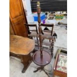 A MAHOGANY STANDARD LAMP ON TRIPOD SUPPORT WITH CIRCULAR LOWER SHELF