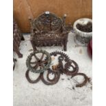 A COLLECTION OF VINTAGE CAST ITEMS TO INCLUDE HORSE SHOES, COGS AND A FIRE GRATE