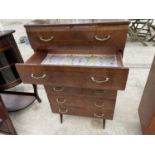 A RETRO CHEST OF SIX DRAWERS ON BLACK TAPERED LEGS, BY MEREDEW