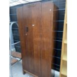 A SINGLE OAK WARDROBE