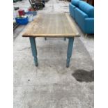 AN OAK AND PAINTED DINING TABLE