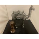 A LARGE CAST METAL CAMEL AND A MIDDLE EASTERN STYLE COFFEE POT